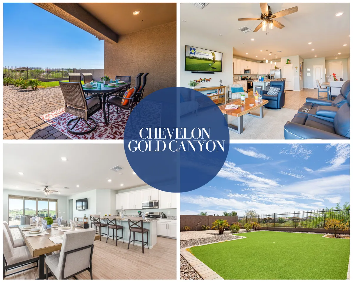 The image showcases the home's beautifully landscaped backyard, complete with a stylish outdoor dining set perfect for gathering at sunset. Large windows reveal inviting living room seating and a modern kitchen island, seamlessly connecting indoor comfort with outdoor relaxation—all set against the backdrop of Gold Canyon's natural beauty.